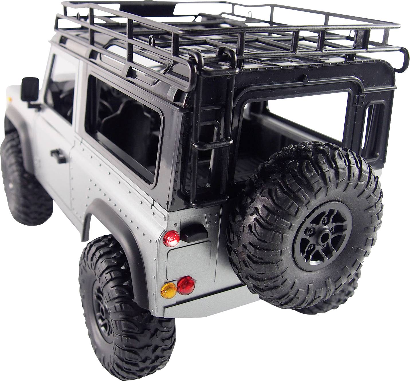 Ein graues Modellauto eines Geländewagens mit Reserveradhalterung hinten und Dachträger. Das Design zeigt robuste Outdoor-Elemente.