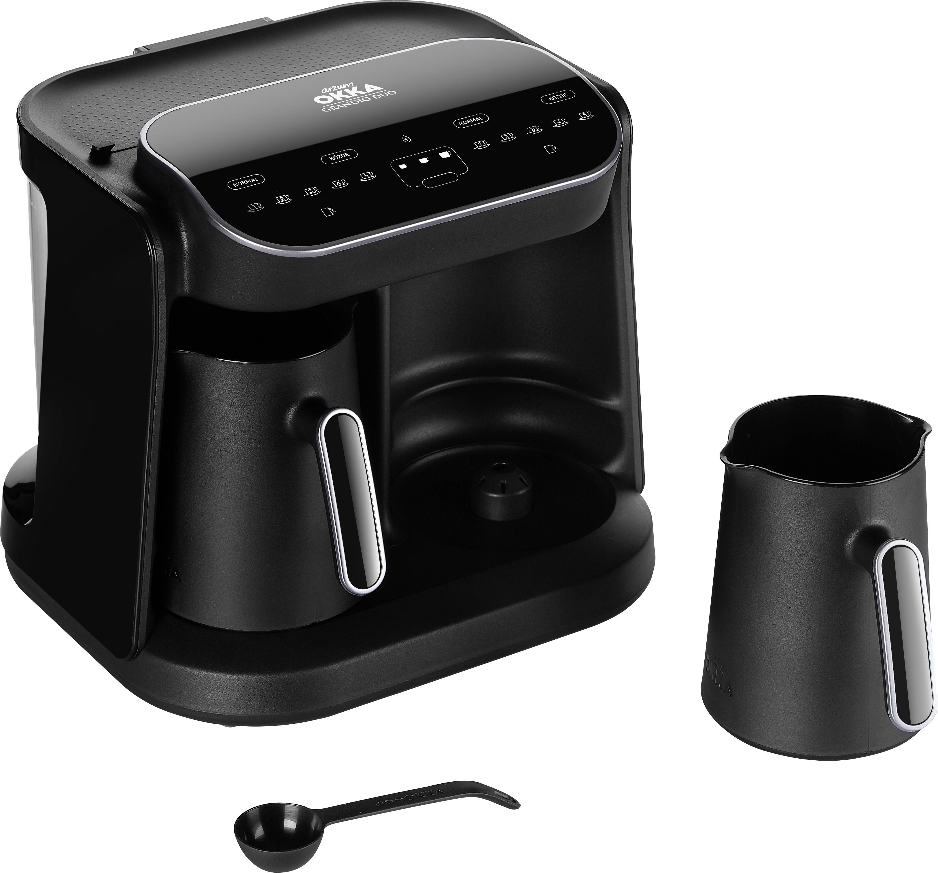 Schwarze Kaffeemaschine mit digitalem Display, Kanne und Messlöffel daneben.