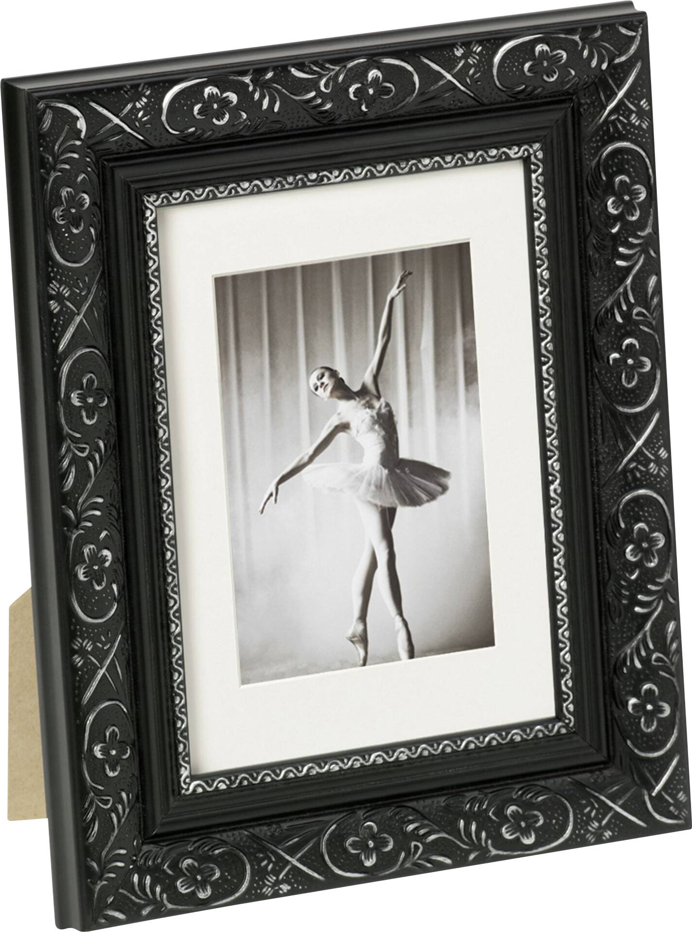Ein gerahmtes Schwarzweißfoto zeigt eine tanzende Ballerina in einem Tutu, die elegant auf einem Bein balanciert.