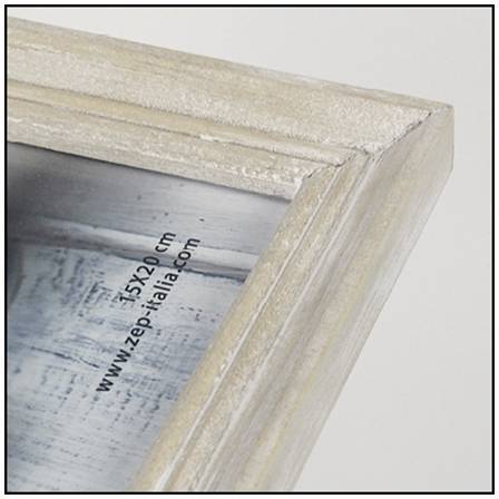 Nahaufnahme einer Fotoecke in einem Holzrahmen, auf dem der Text '15x20 cm' und 'www.zep-italia.com' zu sehen sind.