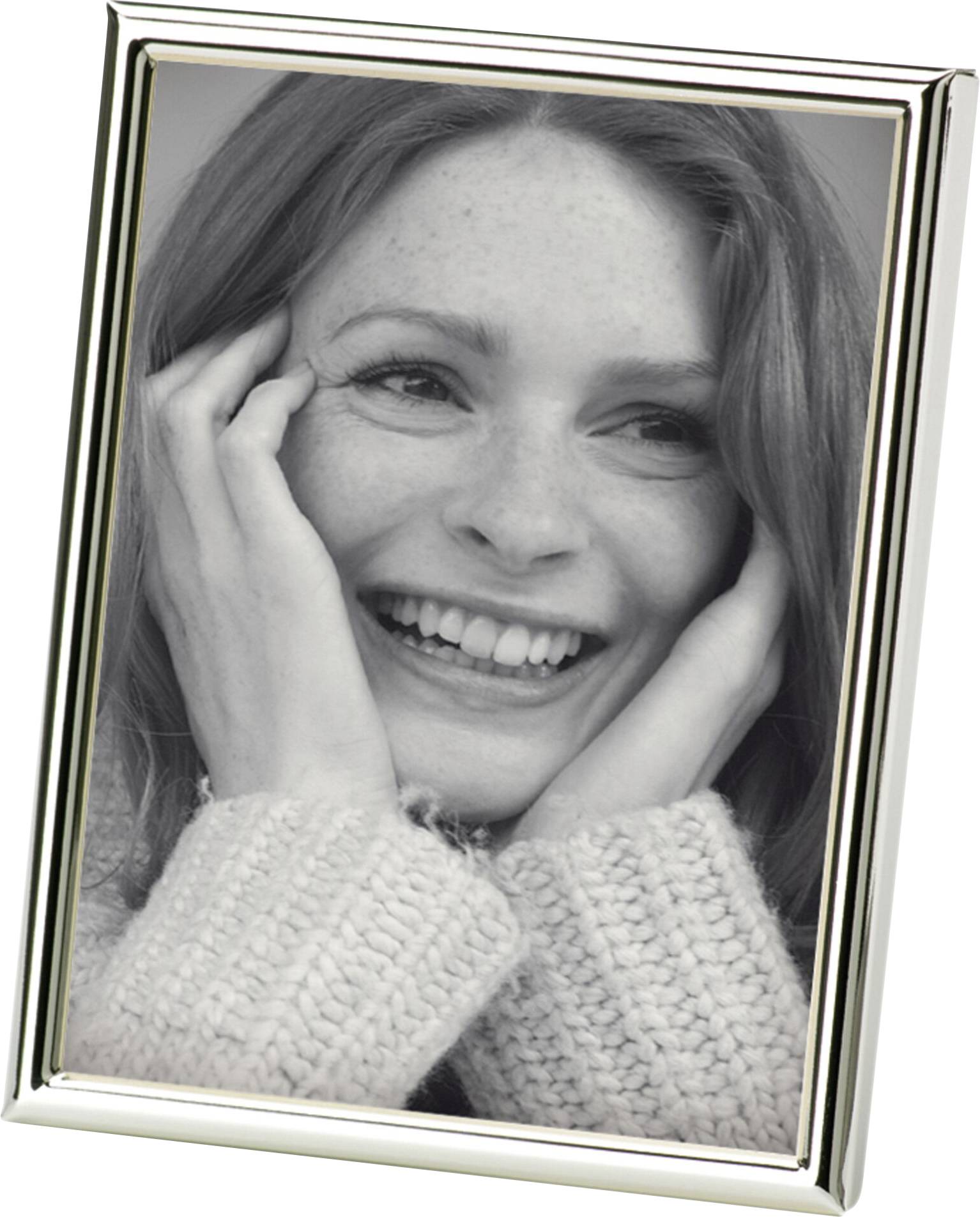 Eine lachende Frau hält ihr Gesicht mit den Händen, in einem silbernen Bilderrahmen eingerahmt.