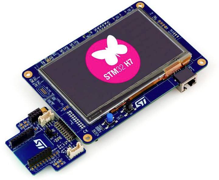 Ein STM32 Entwicklungsboard mit einem Display, das das STM32 H7 Logo auf einem rosa Hintergrund mit einem Schmetterlingssymbol zeigt.