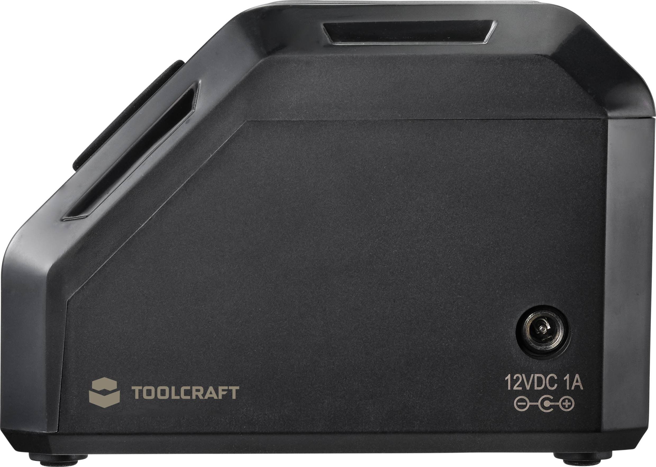 Schwarzes Ladegerät von Toolcraft, Seitenansicht. Beschriftung '12VDC 1A' zeigt die Spannung und Stromstärke des Geräts an.