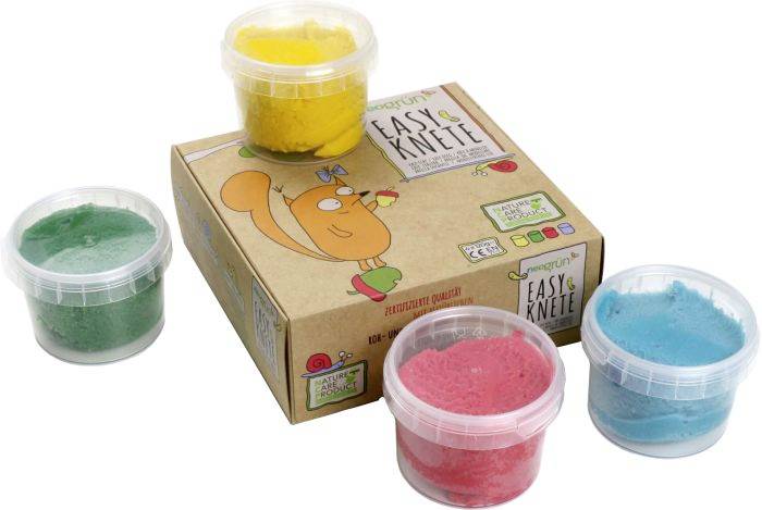 Vier Dosen Knete in Grün, Gelb, Rot und Blau, neben einer Verpackung mit einem illustrierten Tier. Geeignet für Kinder zum Basteln.