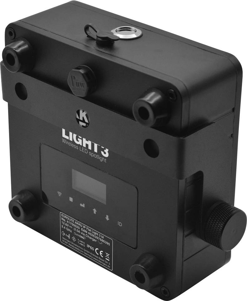 Ein rechteckiges, schwarzes Gerät mit der Aufschrift 'LIGHT3 Wireless LED spotlight'. Oben ist ein Metallring angebracht.