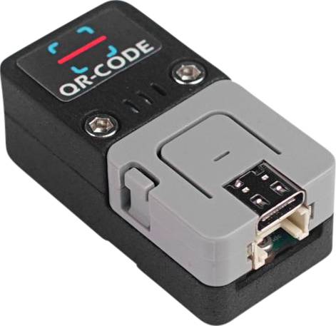 Ein schwarzes Gerät mit der Aufschrift 'QR-CODE' und zwei Schrauben an der Oberseite. Eine USB-Schnittstelle ist sichtbar.