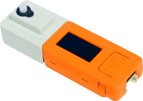 Das Bild zeigt ein orangefarbenes, tragbares elektronisches Gerät mit einem kleinen Display und der Aufschrift 'M5'.