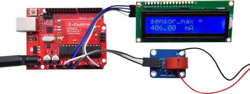 Ein Mikrocontroller mit Sensor und Display zeigt 'sensor_max = 486.00 mA'. Darstellung einer Messschaltung zur Strommessung.