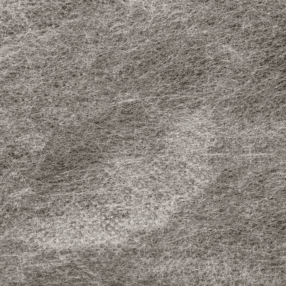 Eine Strukturaufnahme einer grauen, faserigen Oberfläche, möglicherweise von einem Stück Stoff oder Papier, mit feiner Textur.