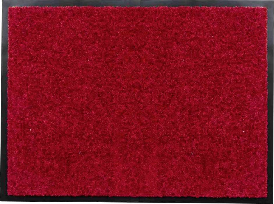 Rote Fußmatte auf grauem Hintergrund.