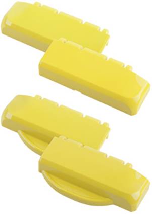 Drei gelbe Plastikelemente mit runden und rechteckigen Formen, möglicherweise Teile eines größeren Sets oder Systems.