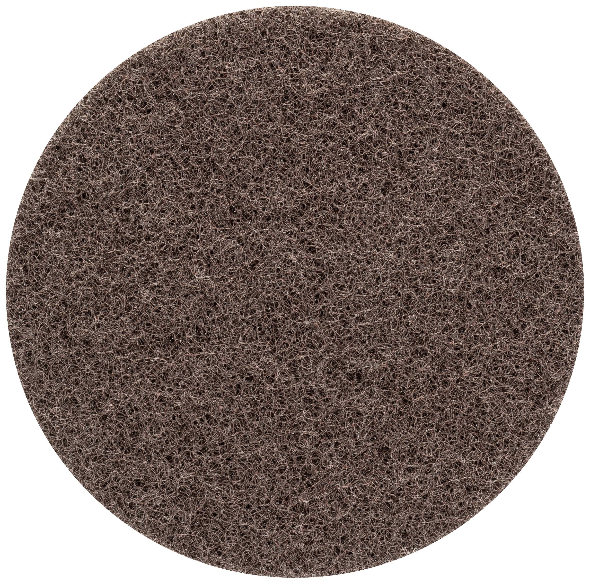 Ein rundes, braunes scheuerndes Pad, das typischerweise in der Reinigung verwendet wird.