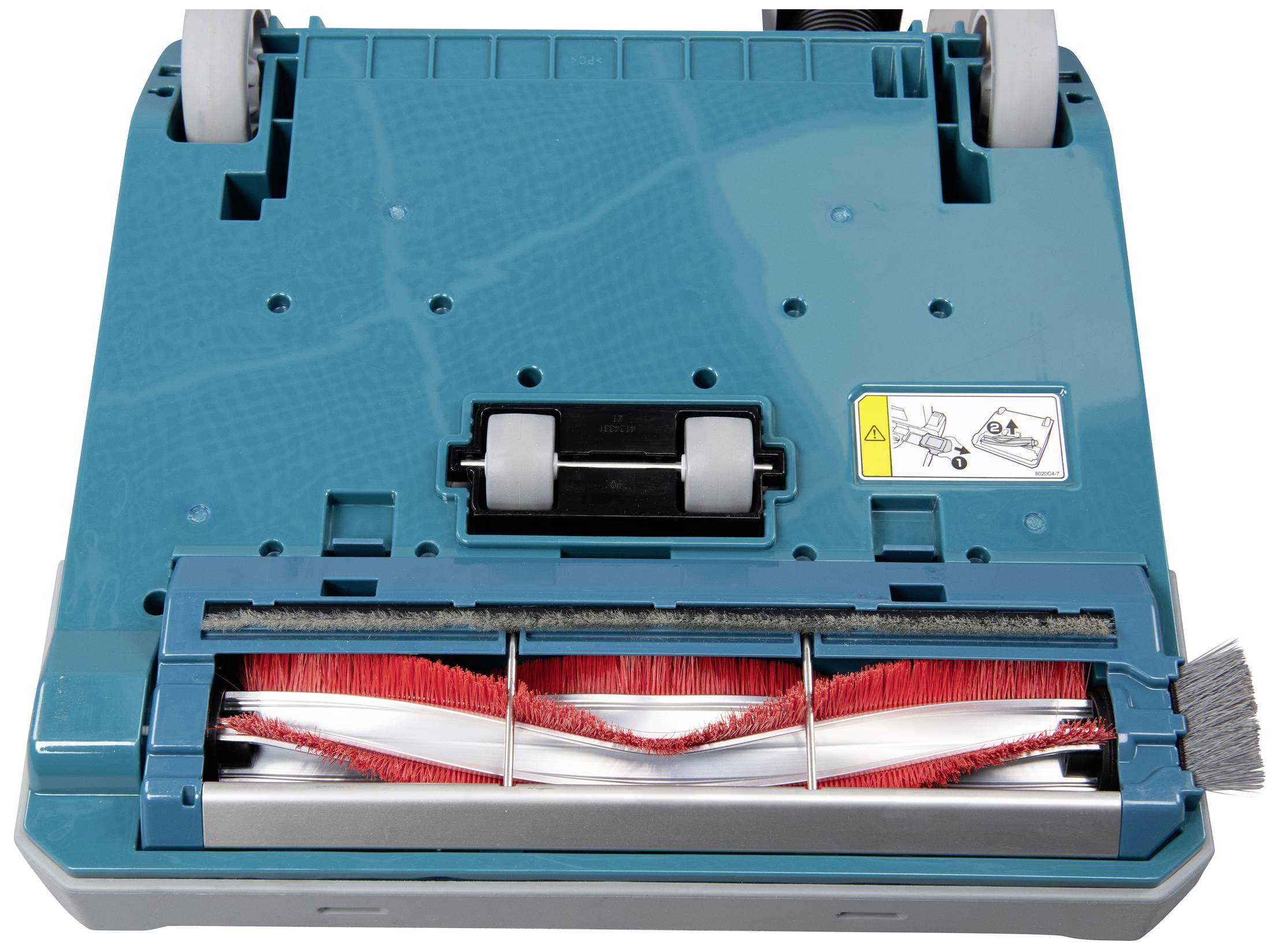 Rückseite eines Staubsaugers mit sichtbarer rotierender Bürste und Hinweisaufkleber. Geeignet zur Teppichreinigung.