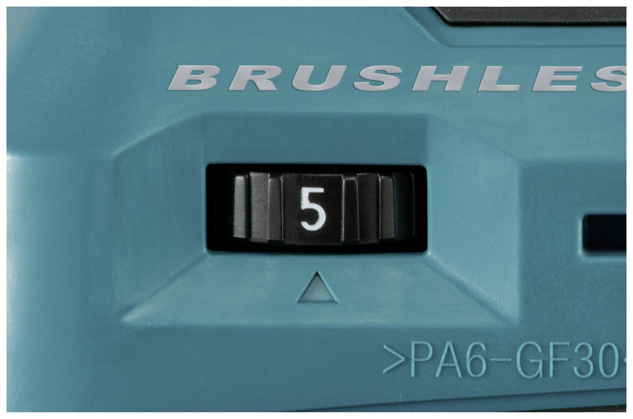 Nahaufnahme eines Drehschalters auf einem Gerät. Der Schalter steht auf Stufe 5. Der Text 'BRUSHLESS' ist darüber sichtbar.