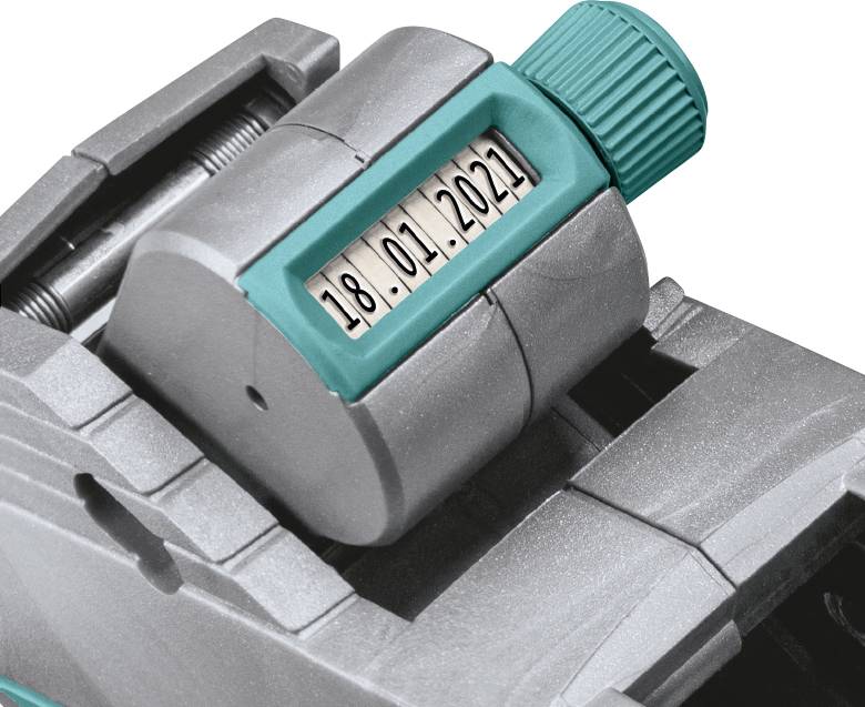Eine graue Maschine mit einem grünen Ziffernblatt zeigt das Datum '18.01.2021'.