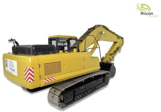 Ein gelber Modellbagger mit Kettenlaufwerk vor weißem Hintergrund. Markenlogo 'thicon models' in der oberen rechten Ecke.