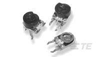 Drei silberne und schwarze elektronische Bauteile mit drei Anschlüssen in unterschiedlichen Ausrichtungen zueinander.