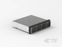 Ein graues Serverlaufwerk mit einem schwarzen Frontpanel, das Slots für Laufwerke hat. Es liegt auf einer weißen Oberfläche.