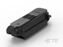 Ein rechteckiges, schwarzes elektronisches Gerät mit glatter Oberfläche. Es trägt das Logo eines Unternehmens.