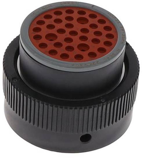 Eine schwarze zylindrische Kunststoffkomponente mit einer roten perforierten Oberseite mit mehreren Löchern, möglicherweise Teil eines Luft- oder Flüssigkeitsfiltrationssystems.