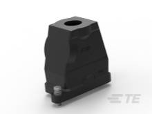 Ein schwarzes technisches Bauteil auf weißem Hintergrund, möglicherweise ein Gehäuse mit einer Öffnung oben und Befestigungsschrauben unten.