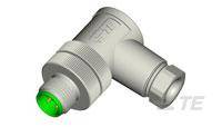Metallischer Elektronikstecker mit grünem Anschluss. Wird für industrielle Anwendungen verwendet.