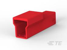 Roter Kunststoffstecker mit rechteckiger Öffnung auf weißem Hintergrund, eher technisches Bauteil.