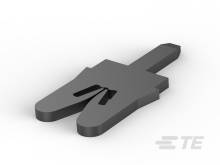 Ein schwarzes Stück in Form eines simplifizierten Hauses, das auf einem weißen Hintergrund liegt.