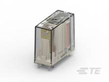 Ein transparentes Relaisgehäuse mit sichtbaren internen Komponenten. Es zeigt Steckerstifte an der Unterseite zur Montage auf einer Platine.