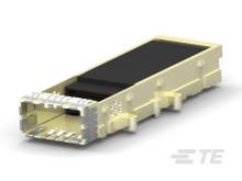 Ein gelbes elektronisches Modul mit Metallkontakten auf einer Seite liegt auf einer weißen Oberfläche. Es scheint ein technisches Gerät zu sein.