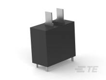 Ein schwarzer, rechteckiger elektronischer Bauteil auf vier Metallstiften. Auf der Oberseite befinden sich zwei vertikale Laschen.