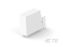 Weißer Block mit einem hervorstehenden, flachen Metallteil, auf einem grauen Untergrund.