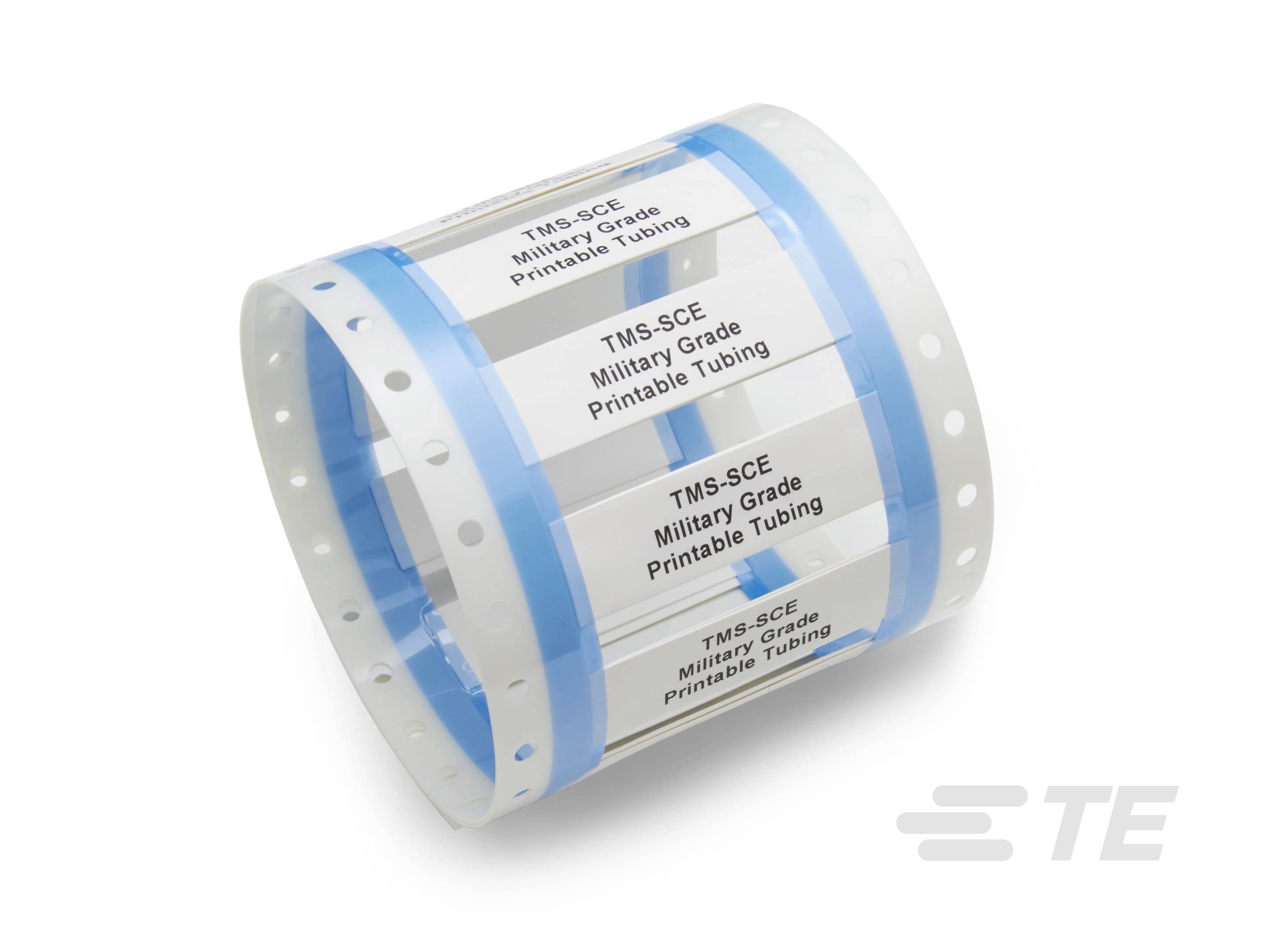 'Transparente, zylindrische Verpackung mit weißen Etiketten, die 'TMS-SCE Military Grade Printable Tubing' anzeigen.'