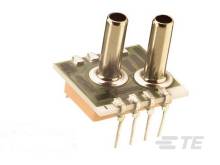 Elektronisches Bauteil mit zwei Metallzylindern und vier Anschlussstiften, vermutlich ein Sensor auf einer Platine montiert.