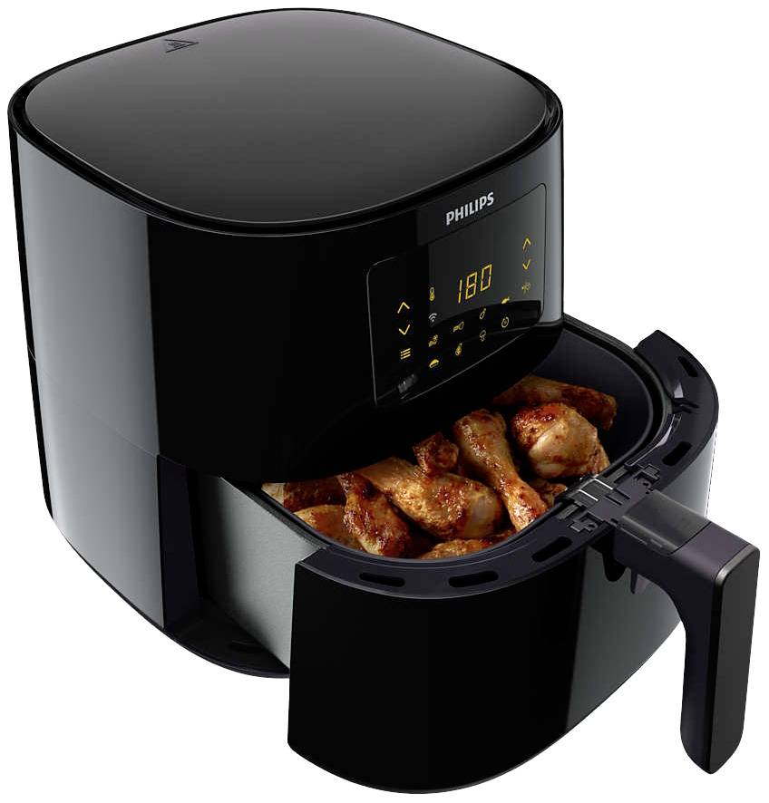 Schwarzer Philips Airfryer mit digitalem Display, zeigt 180 Grad. Gefüllte Schublade mit gebratenen Hähnchenteilen.