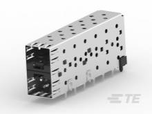 Ein metallisches Gehäuse mit zahlreichen runden Öffnungen, wahrscheinlich ein technisches Bauteil, wie ein Stecker oder Adapter.