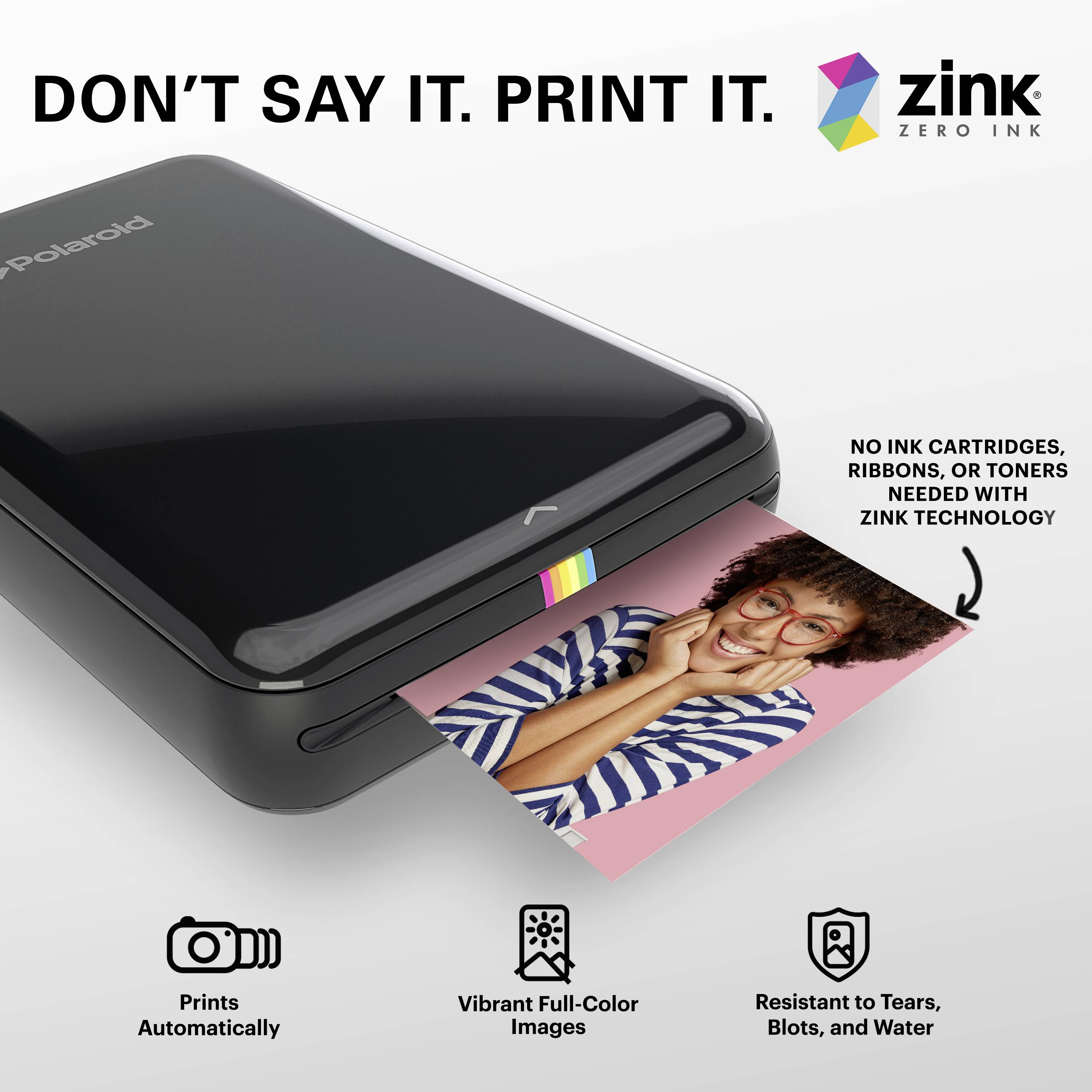 Schwarzer Fotodrucker druckt ein Farbfoto einer Person in gestreiftem Hemd. Text: 'DON'T SAY IT. PRINT IT.' und Zink-Logo oben rechts.
