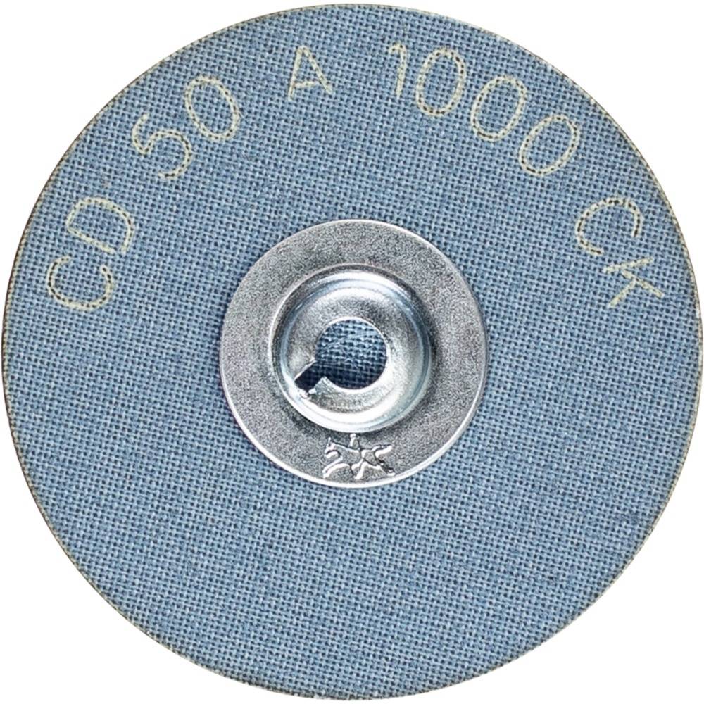 Schleifscheibe mit blauer Körnung. Beschriftung: 'CD 50 A 1000 CK'. Geeignet für Feinschliffarbeiten. Zentrales Metallstück.