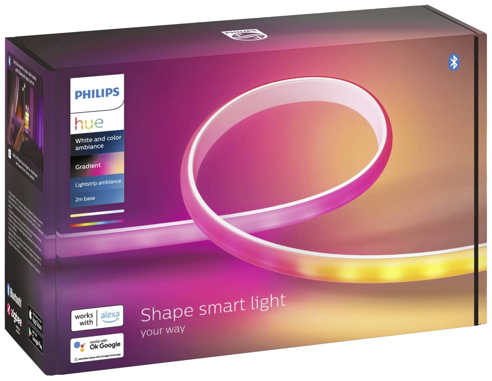 Verpackung der Philips Hue Gradient Lightstrip, zeigt leuchtenden Farbverlauf. Kompatibilität mit Alexa und Google Assistant angegeben.