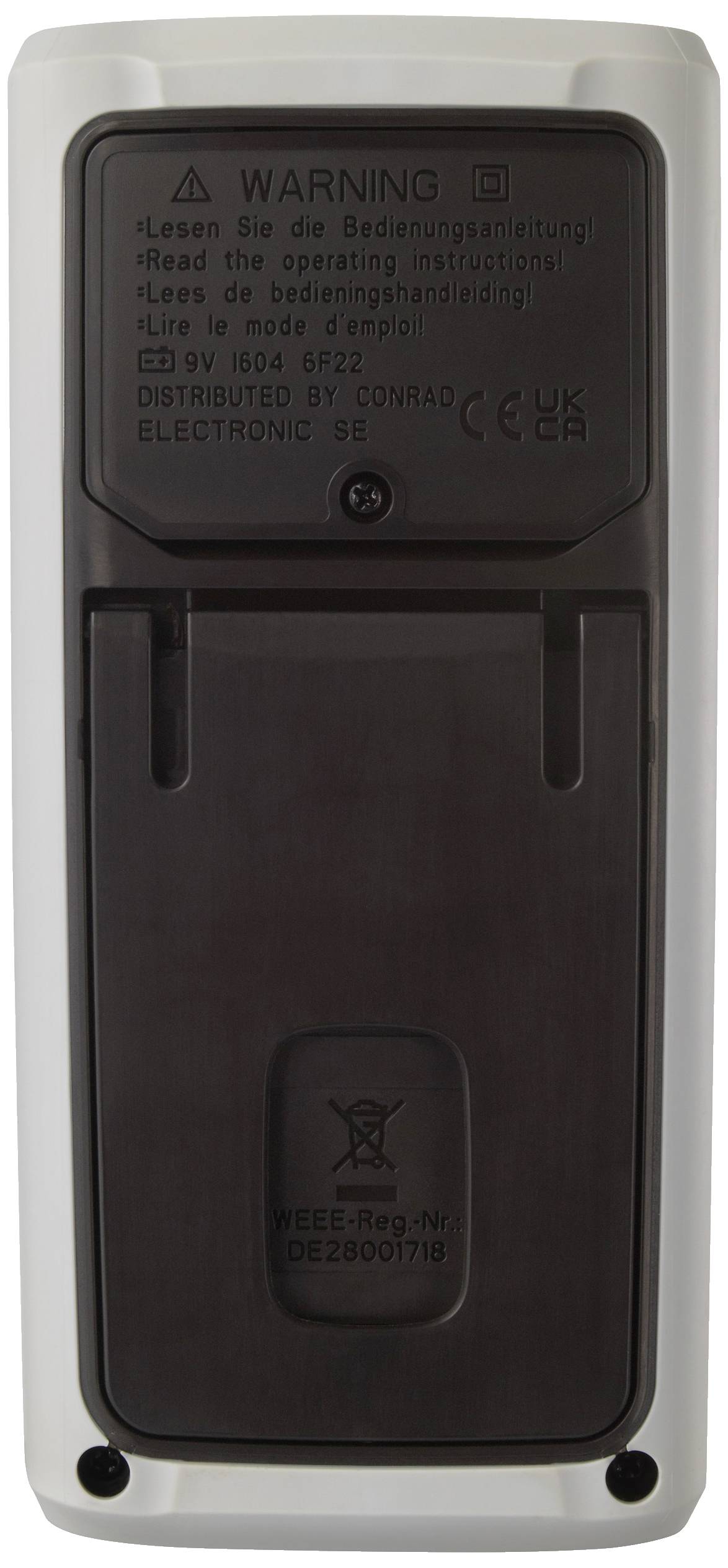 Rückseite eines elektronischen Geräts mit schwarzer Abdeckung und Warnhinweisen zur Bedienungsanleitung in mehreren Sprachen.