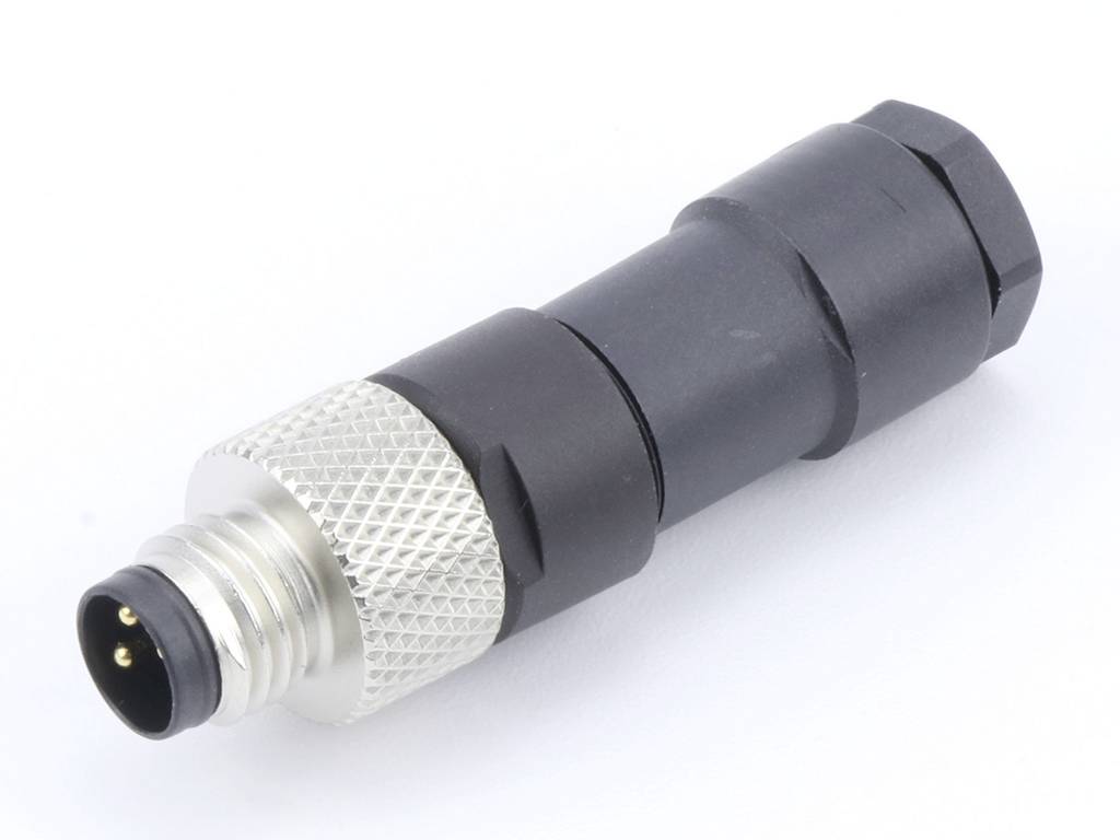 Ein schwarzer, zylindrischer Steckverbinder mit einem metallischen, geriffelten Ring und drei sichtbaren Pins.