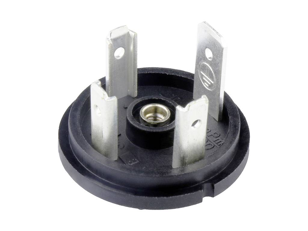 Runde, schwarze Keramikfassung mit vier metallischen Steckklemmen zur Aufnahme von elektrischen Bauteilen, zentraler Anschluss sichtbar.