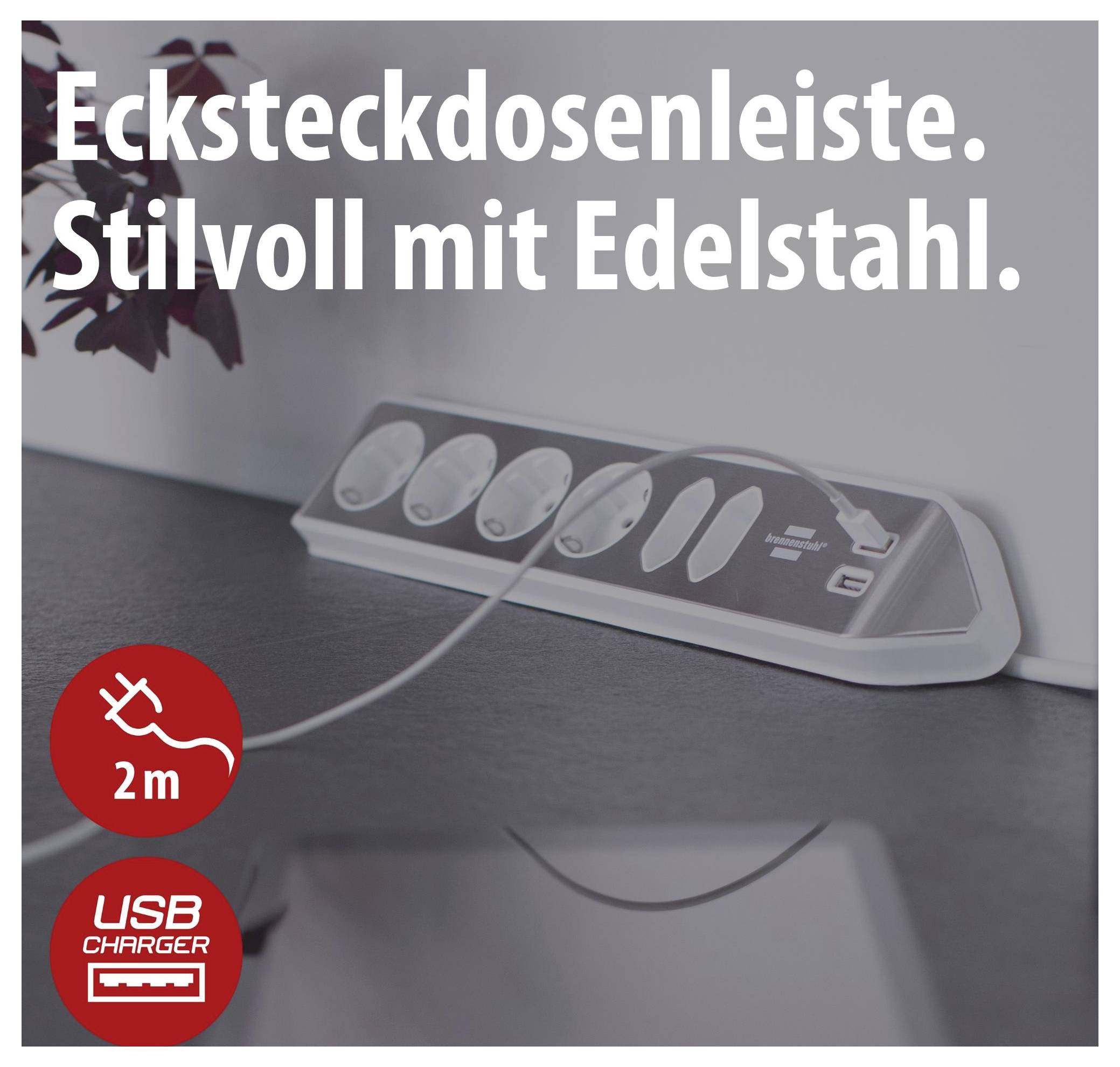 Steckdosenleiste aus Edelstahl mit mehreren Steckplätzen und USB-Ladeanschluss; Text: 'Steckdosenleiste. Stilvoll mit Edelstahl.'