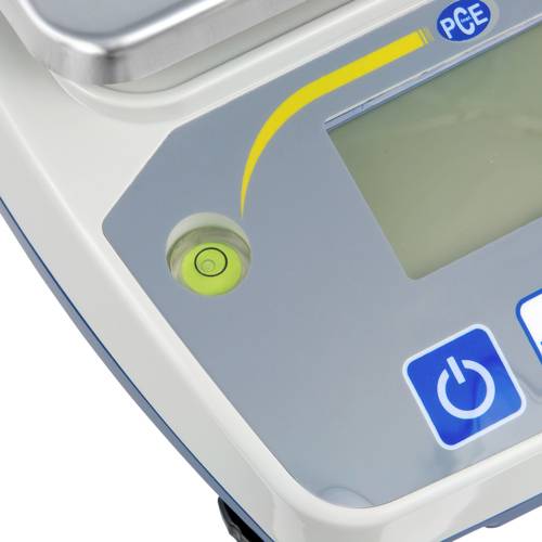 Nahaufnahme eines technischen Geräts mit Bildschirm und Bedienelementen; gelber Pfeil und Symbole für Ein- und Ausschalten sichtbar.