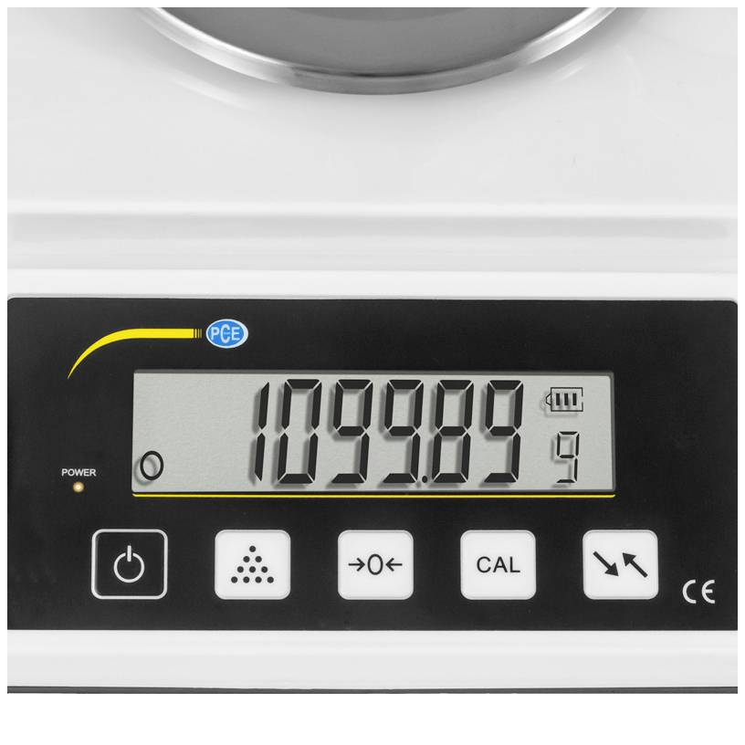 Digitalwaage mit Anzeige '1099.89g', darunter Tasten: Power, Cal, und Navigationstasten. Oben links CE-Zeichen und PCE-Logo.