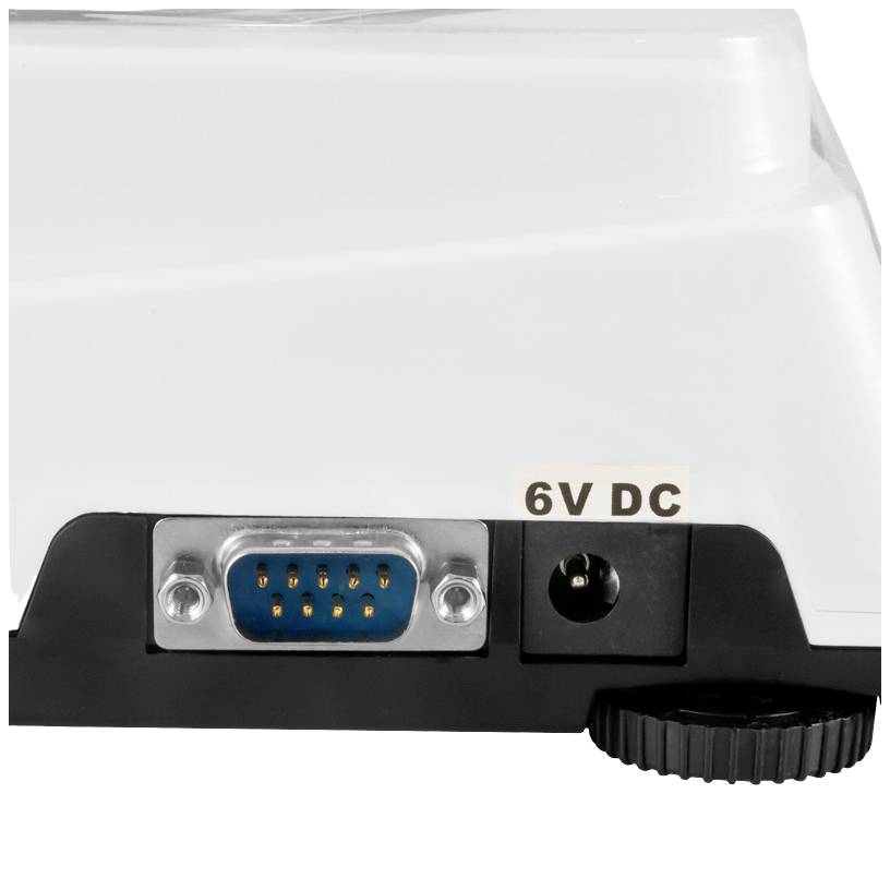 Nahaufnahme eines elektronischen Geräts mit einem 6-Pin-Anschluss, einer DC-Strombuchse mit Aufschrift '6V DC', und einem Rändelrad.