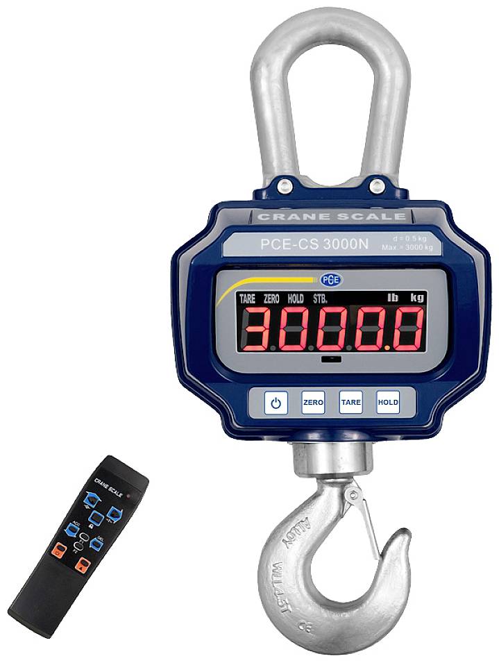 Eine dunkelblaue Kranwaage mit großem Display zeigt '3000.0' an. Daneben liegt eine schwarze Fernbedienung mit bunten Symbolen.