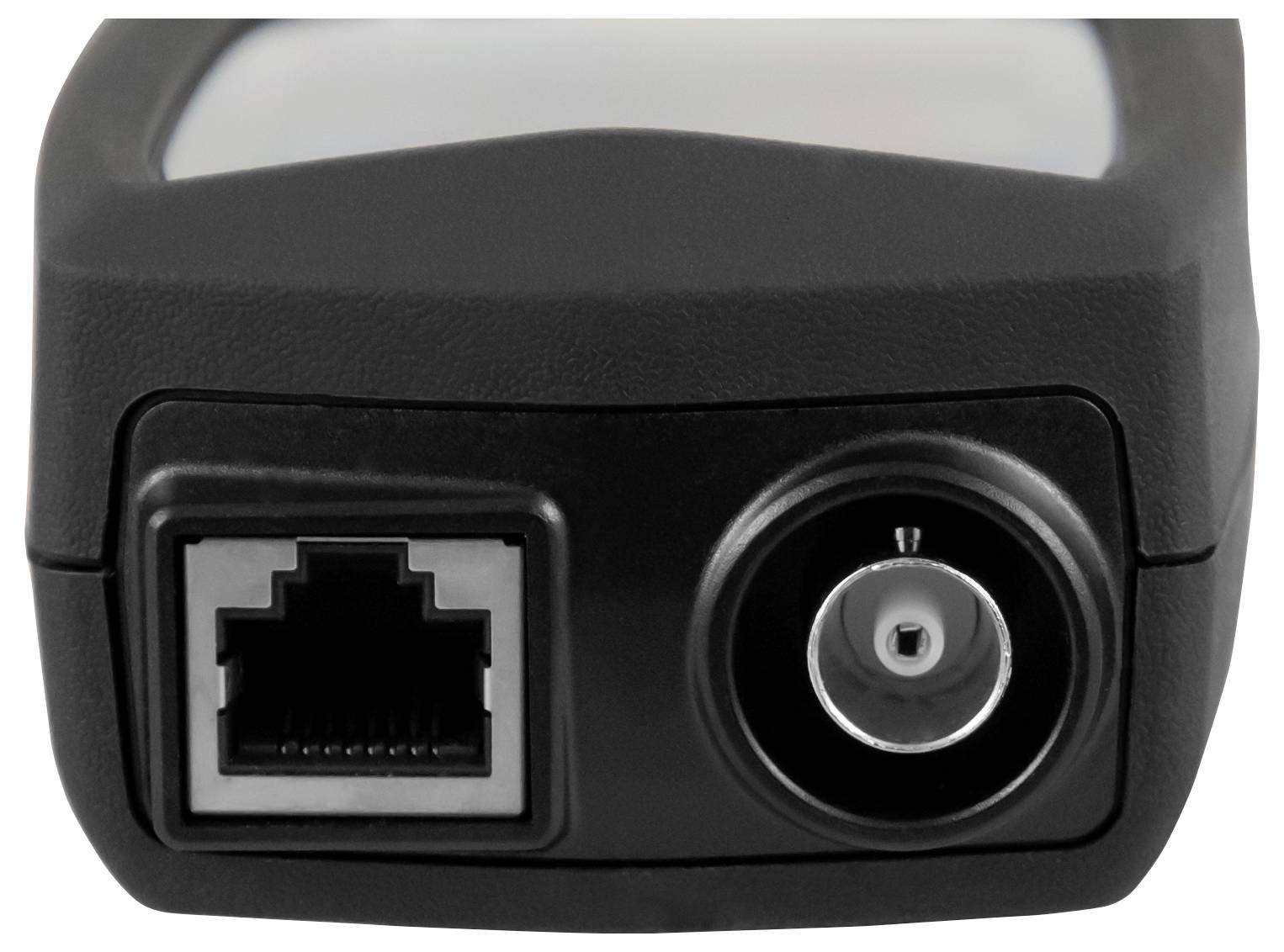 Close-up of a device rear panel with an Ethernet port and a coaxial power jack.