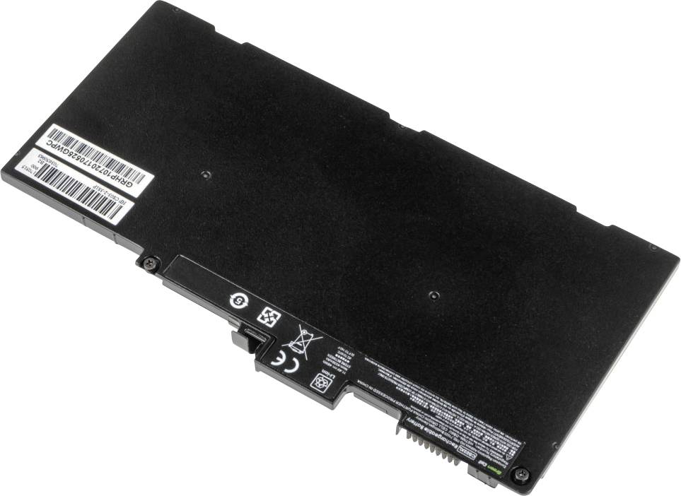 Eine schwarze Laptop-Batterie mit Etiketten und Anschlüssen, die auf einer weißen Oberfläche liegt.