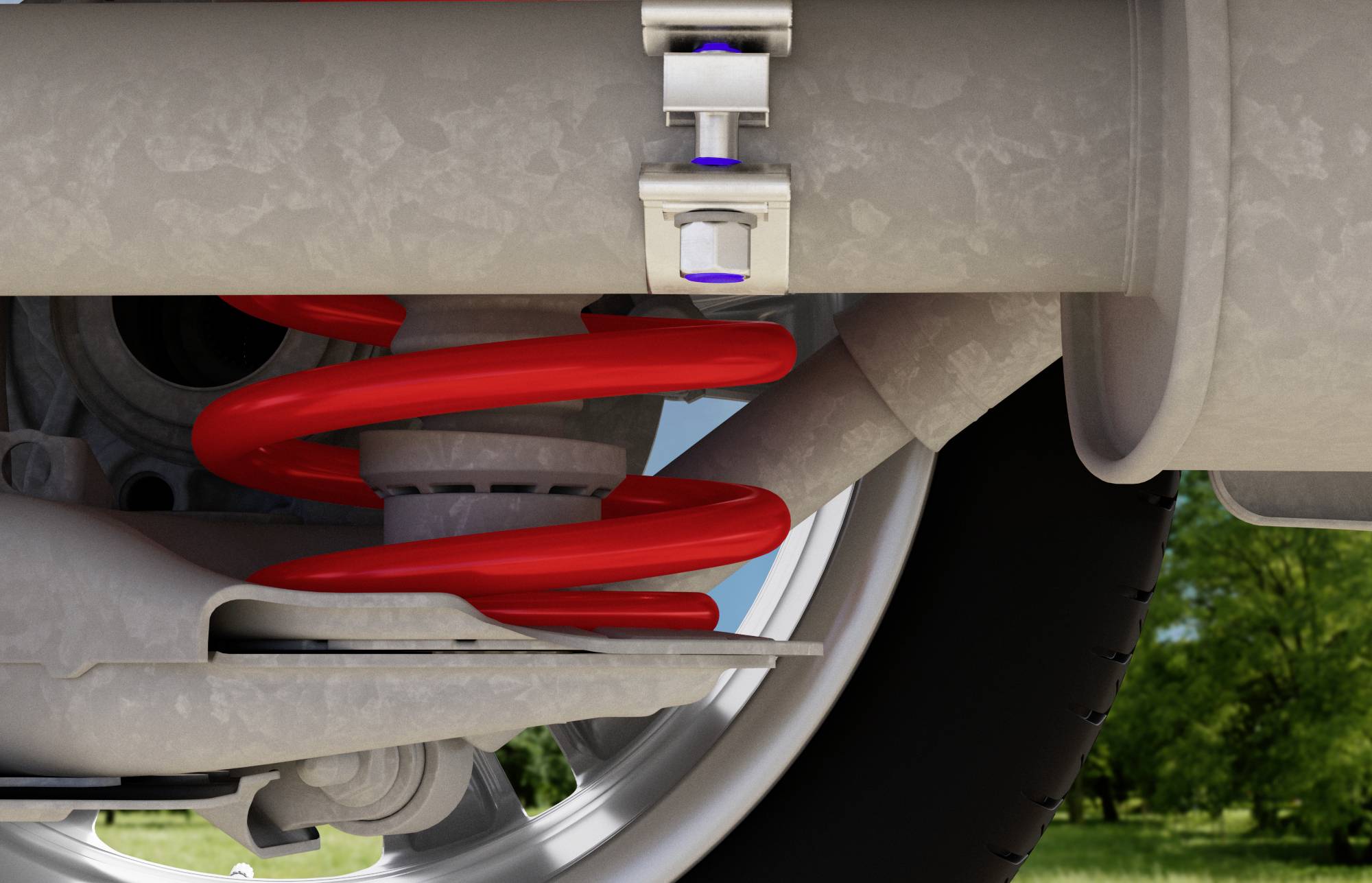 Nahaufnahme einer Autoaufhängung mit roter Spiralfeder und silbernen Befestigungsteilen. Im Hintergrund ist ein Rad und Reifen sichtbar.